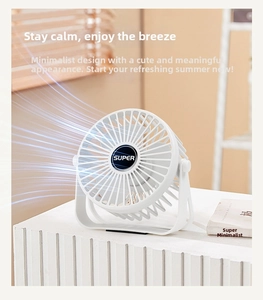 Detail of white portable desktop fan with adjustable U-shaped stand and circular grill