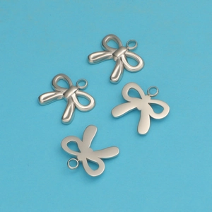 Detailed view of four silver stainless steel bow pendants with loops on blue background