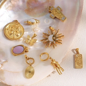 Selection of 18K gold plated stainless steel pendants including shell and moth designs