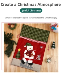 Detailed view of a red Christmas gift bag with a 3D snowman and festive pine decorations