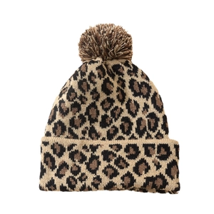 Leopard print knitted beanie for women with soft faux fur pom-pom on white background