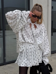 Polka dot two-piece set featuring flare sleeve tie-front top and high waist skirt