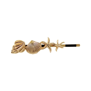 Detailed close-up of golden alloy hair clip with starfish and seashell embellishments