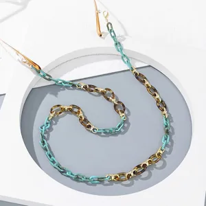 Ethnic acrylic eyewear chain in turquoise and amber resin with golden lobster clasps