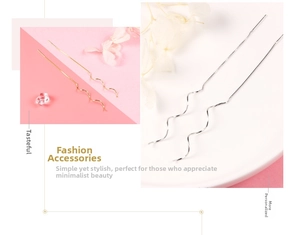 Detail of elegant S-shaped wave threader earrings in polished gold and silver finishes