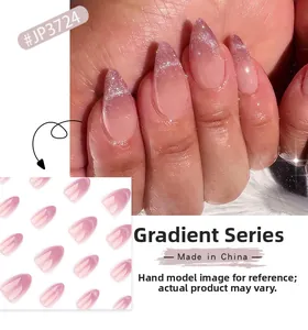 Close-up of pink-purple gradient cat-eye press-on nails with silver glitter details