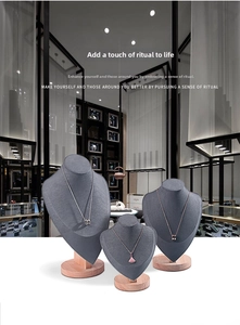 Three-tier grey microfiber necklace display stands with solid wood circular bases
