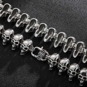 Macro view of hip hop skull bracelet featuring detailed stainless steel links and clasp