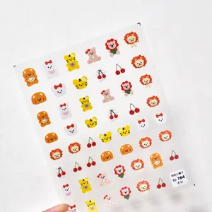 Detail of thin 5D nail stickers featuring cute cartoon lion, bear, and rabbit motifs