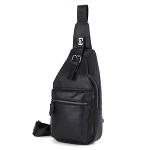 Detailed close-up of a black leather chest bag with multiple zipper pockets and texture