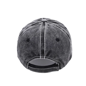 Rear view of washed denim baseball cap featuring white contrast stitching and adjustable strap