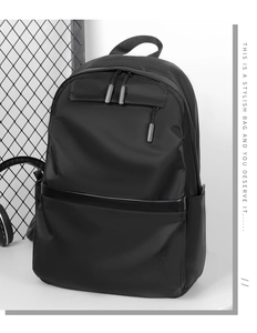 Detailed shot of a black minimalist backpack featuring smooth nylon fabric and durable zippers