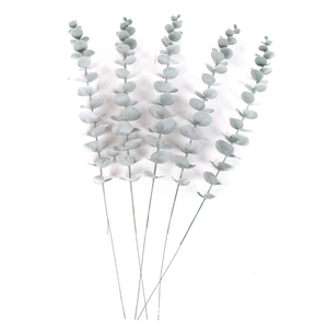 Detailed view of five grey-green faux eucalyptus stems with realistic seeds and leaves