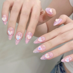 Pink aurora long almond press-on nails with 3D heart design and gradient glitter finish