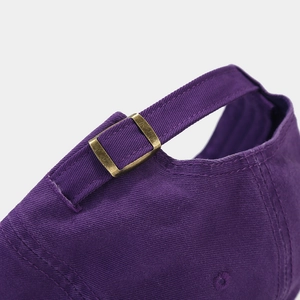 Purple cotton baseball cap with adjustable metal bronze buckle strap shown from the back
