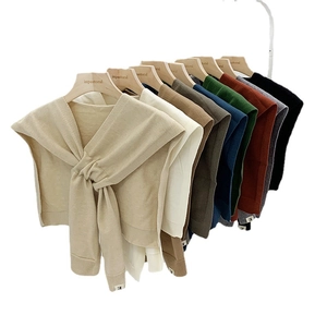 Knitted shawl wrap available in nine solid colors with front tie design for women
