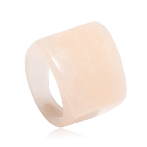Detailed view of wide resin ring in nude pink with shimmering pearlescent finish