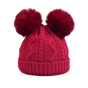 Dark red cable knit beanie with two large faux fur pom-poms for kids and parents