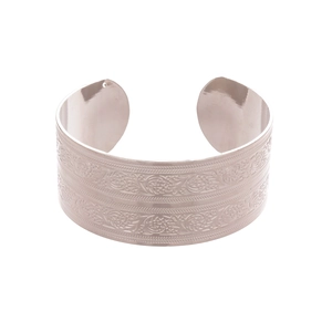 Silver vintage wide cuff bracelet with intricate floral etching and ethnic metal patterns