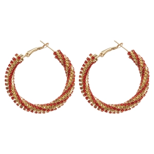 Sparkly gold hoop earrings with red rhinestones in a twisted luxury court style