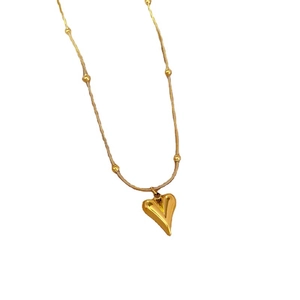 Gold heart pendant necklace with bead chain design on a clean white background