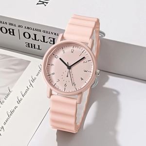 Detailed view of pink student quartz watch with wavy texture silicone strap on soft background