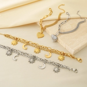 18K gold plated stainless steel layered bracelets with sun, moon, and heart pendants