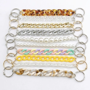 Detail of assorted acrylic, pearl and metal replacement chains with clasps for DIY shoes