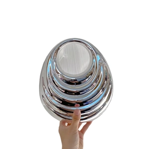 Elegant silver tiered screw-thread oval handbag with a polished metallic finish