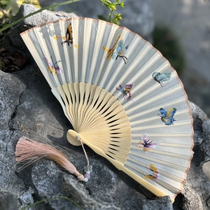 Traditional Suzhou embroidery folding fan with colorful butterflies and pink tassel charm