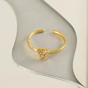 Detailed view of an 18k gold butterfly ring featuring sparkling zircon stones and adjustable band