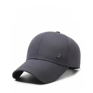 Detail of dark grey baseball cap featuring fine fabric texture and metal R logo