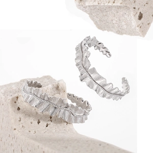 Minimalist silver wavy pleated cuff bracelet with artistic textured finish for women