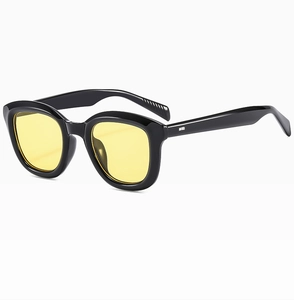 Detail of retro round black thick frame sunglasses with fashion yellow lenses