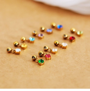 Close-up of square colorful birthstone pendants with gold plated claw setting design