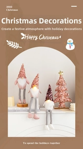 Close-up of LED glowing Christmas gnomes with sequins and a mini festive tree