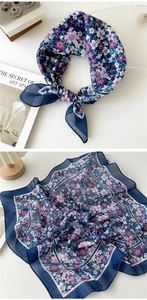 Detail of floral cotton linen square scarf showing navy blue print and lightweight texture