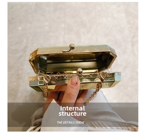 Macro view of geometric gold acrylic evening bag internal structure with metal chain