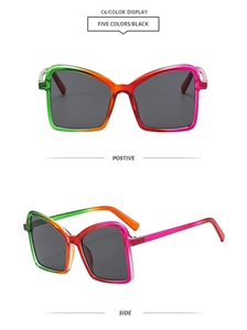 Detail view of oversized square sunglasses featuring a vibrant rainbow gradient plastic frame