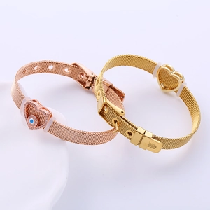 Minimalist stainless steel mesh bracelet with heart charms and evil eye detail