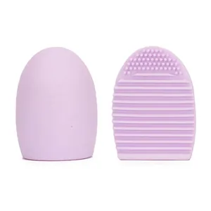Lavender silicone makeup brush cleaning egg with wave textures and exfoliating bristles
