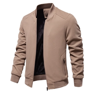 Detail of men's brown waffle knit jacket featuring warm fleece lining and sturdy zipper