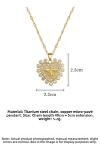 Detailed macro view of heart pendant with bee relief and white cubic zirconia stones