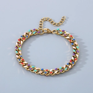 Detail of 18K gold Cuban link bracelet with vibrant colorful enamel drip accents