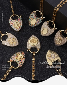 Detailed macro view of 18K gold plated heart lock pendants with colorful zircon inlay