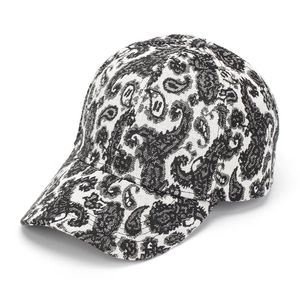 Close-up detail of black and white paisley pattern on a stylish cotton baseball cap