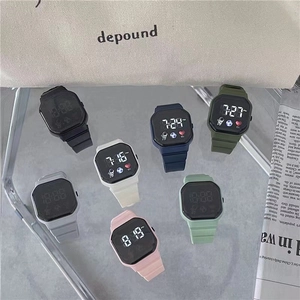 Square LED digital sports watch with silicone strap shown in multiple colors on a stylish bag