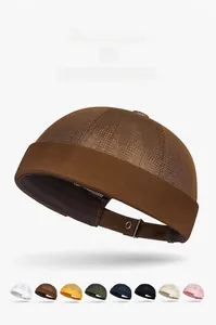 Detail view of breathable mesh Miki hats in various colors with adjustable cotton brim