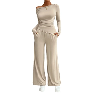 Women's two-piece Y2K outfit with long sleeve ruched top and wide leg pants in beige