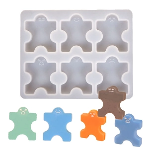 Silicone stacking toy mold with diverse facial expressions and colorful molded figurines